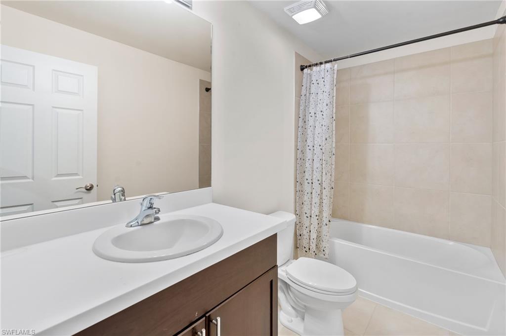 15535 Wildflower Circle Naples, FL 34119 - Photo 18 of 33 a bathroom with a sink toilet and shower