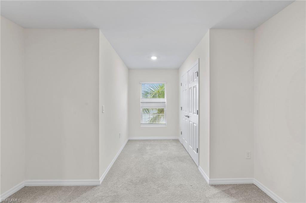 15535 Wildflower Circle Naples, FL 34119 - Photo 22 of 33 a view of a hallway