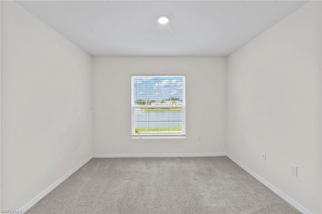 15535 Wildflower Circle Naples, FL 34119 - Photo 23 of 33 an empty room with a window