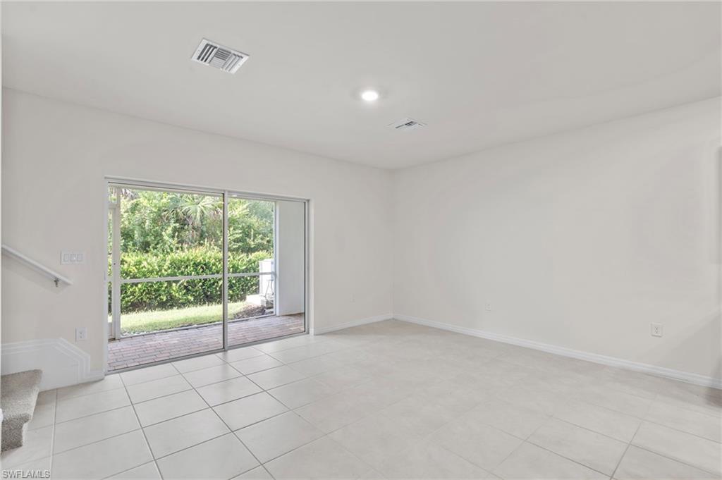 15535 Wildflower Circle Naples, FL 34119 - Photo 8 of 33 a view of an empty room with a window