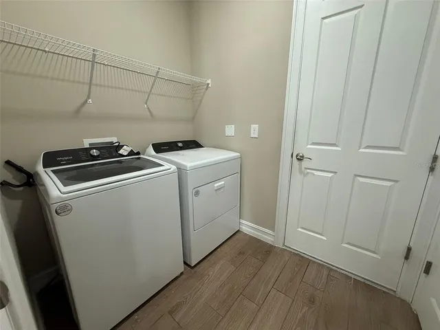 a utility room with dryer and washer