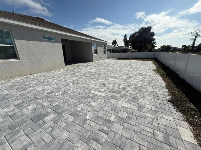 a view of a backyard of the house