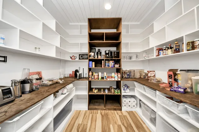 a kitchen view of a stove and cabinets