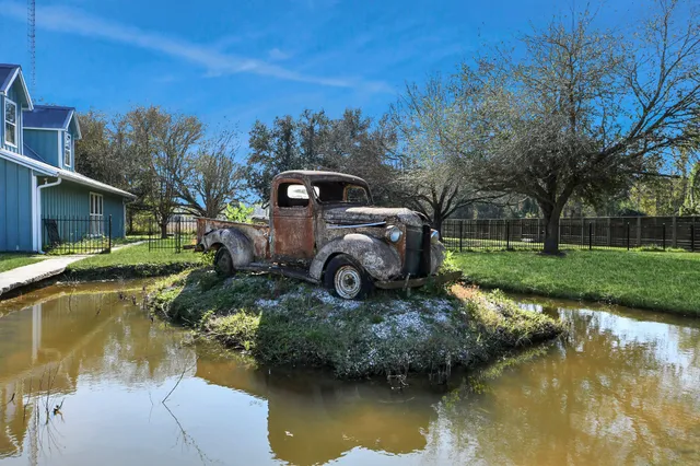 a view of a lake with a house in the background