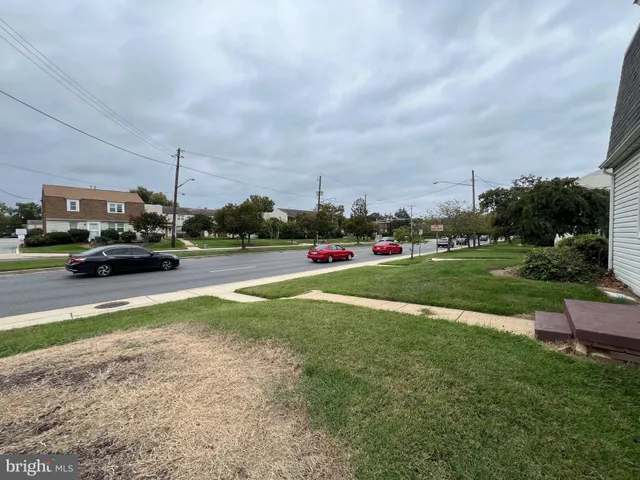 a view of street with parked cars