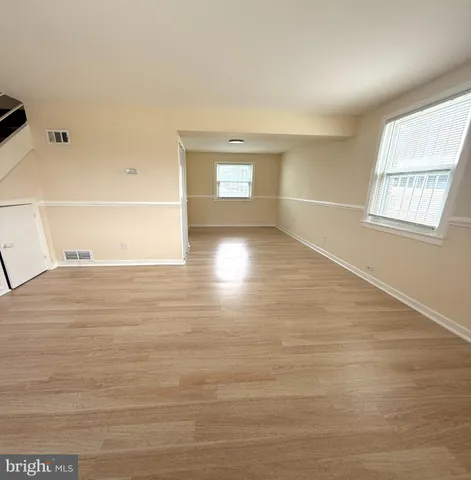 a view of an empty room and window