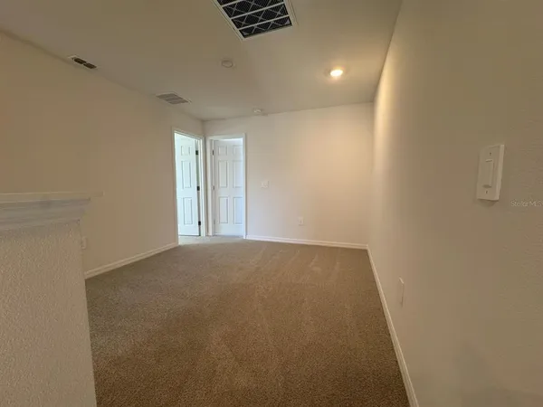 a view of an empty room and window