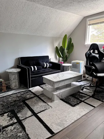 a bedroom with a bed and flat screen tv
