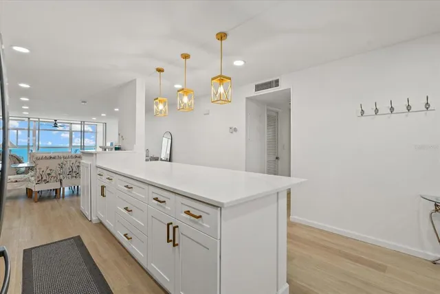 a bathroom with a sink a vanity and a mirror