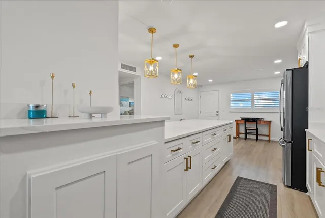 a bathroom with double vanity and a mirror