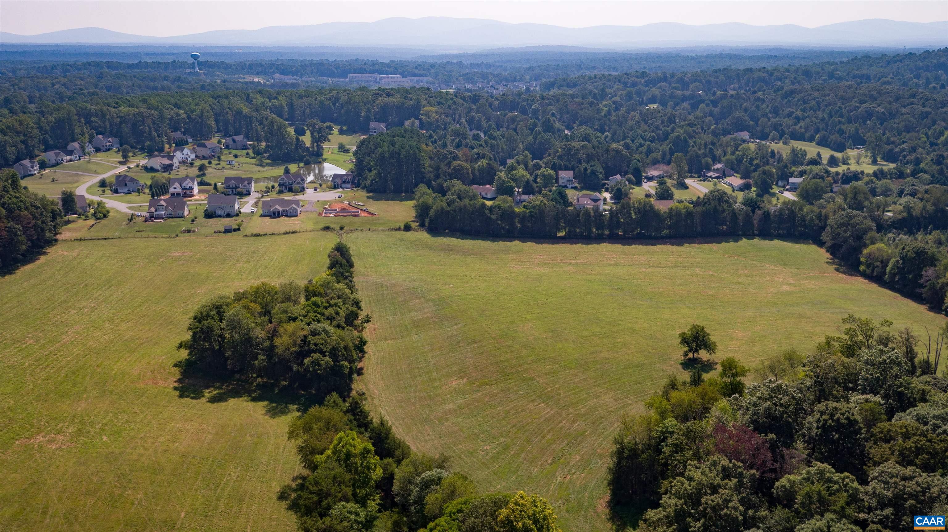 Tm 65-a-23 Tm 65-a-23 Gilbert Road Ruckersville, VA 22968 - Photo 2 of 10 a view of a lake with a mountain