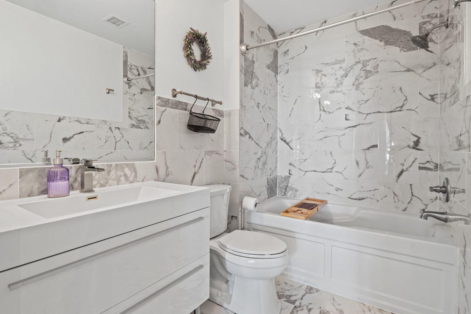 1640 Maple Avenue, Unit 304 Evanston, IL 60201 - Photo 12 of 25 a bathroom with a sink toilet and shower