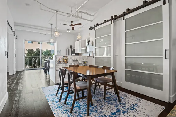 a view of a dining room with furniture and wooden floor