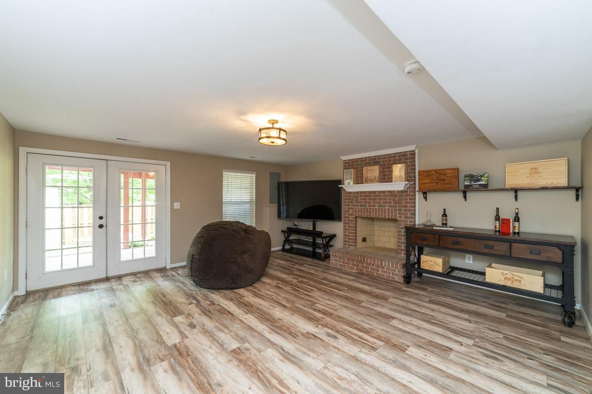 681 Springhouse Square Southeast Leesburg, VA 20175 - Photo 28 of 50 Large rec room w/ wood burning fireplace