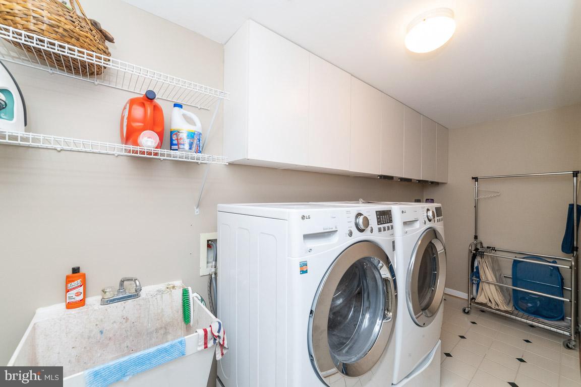 681 Springhouse Square Southeast Leesburg, VA 20175 - Photo 31 of 50 Laundry room w/ front load washer & dryers