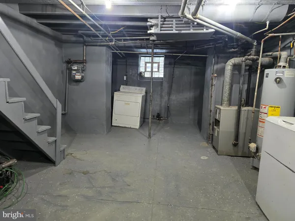 a kitchen with a sink dishwasher a stove top oven a refrigerator with island and cabinets