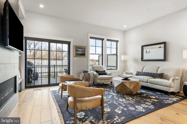 a living room with furniture or couch and a flat screen tv