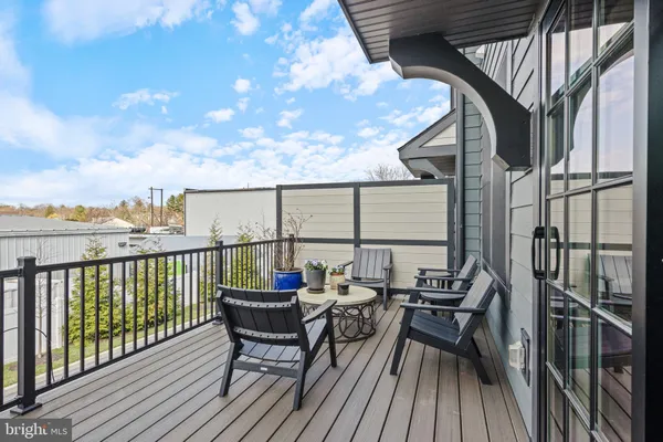 a view of balcony with furniture