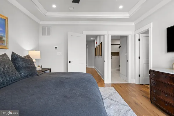 a living room with furniture and a dresser