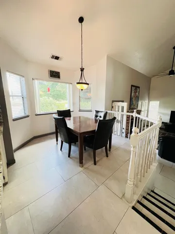 a view of a dining room with furniture