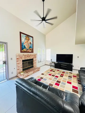 a bedroom with a bed and a fireplace