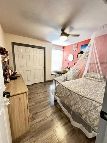 a bed sitting in a room next to a window