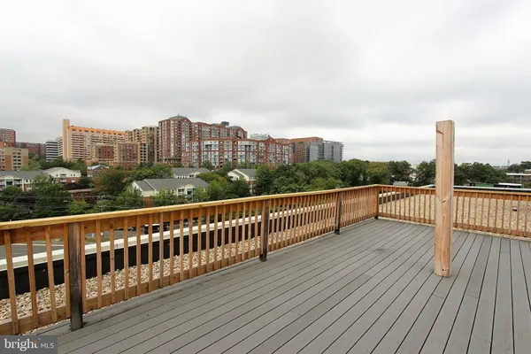 a room with gym equipment and glass windows