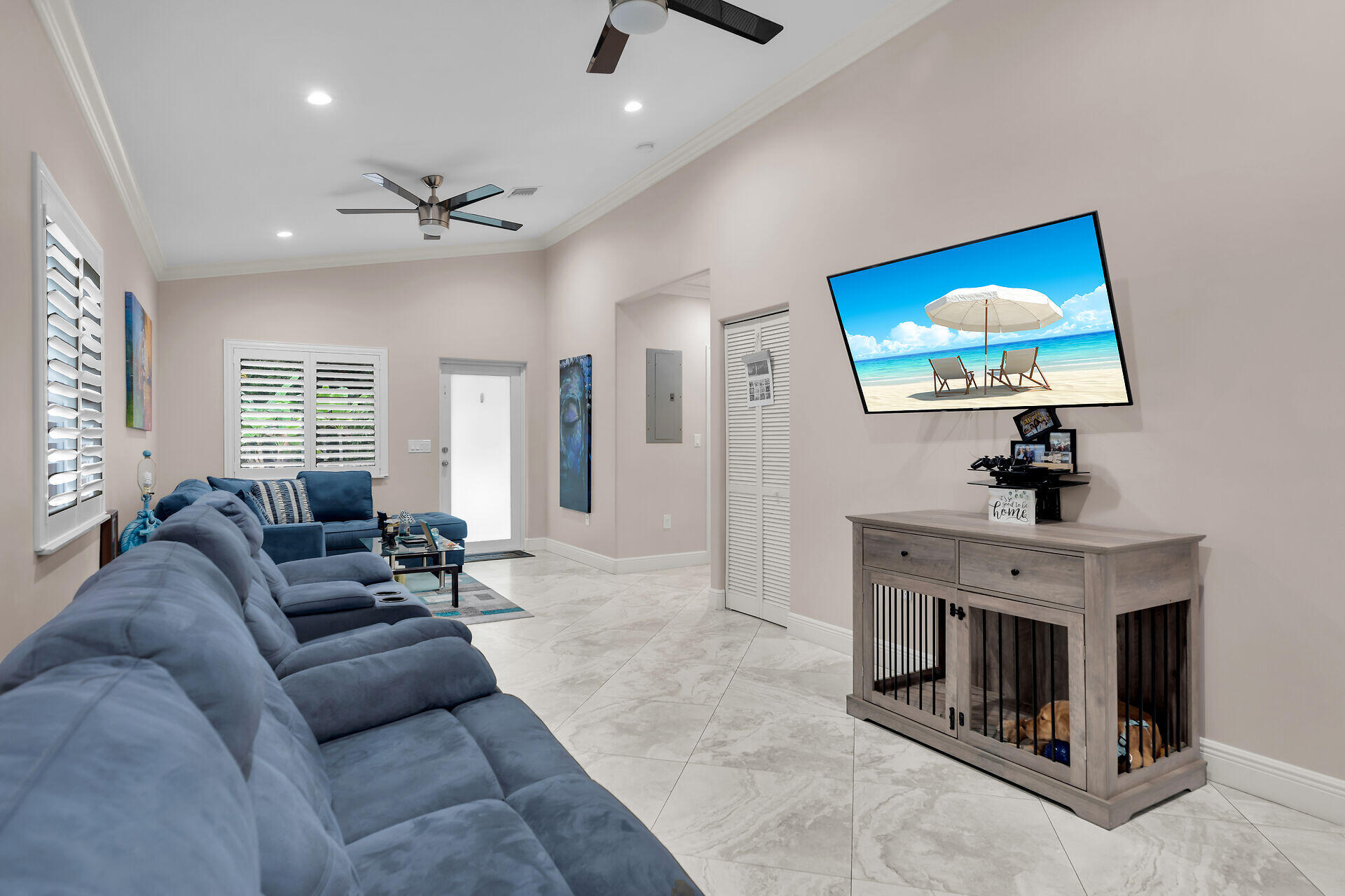 16 Jewfish Avenue Key Largo, FL 33037 - Photo 12 of 69 a living room with furniture a fireplace and a flat screen tv