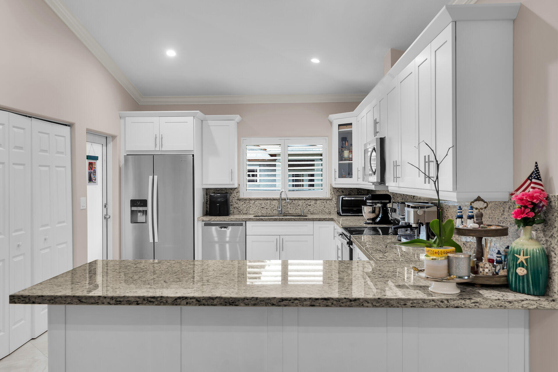 16 Jewfish Avenue Key Largo, FL 33037 - Photo 13 of 69 a kitchen with stainless steel appliances granite countertop a sink refrigerator and cabinets