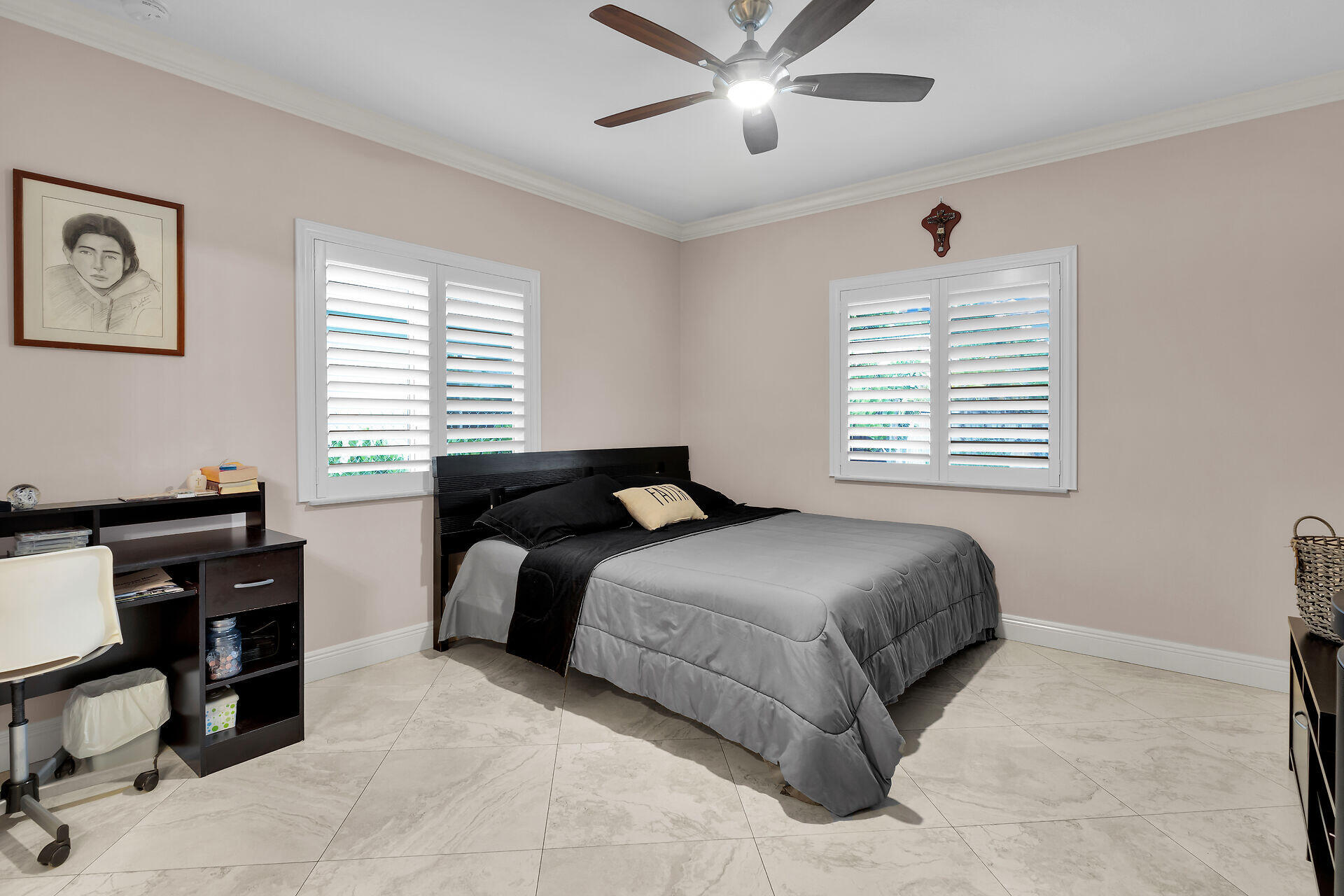 16 Jewfish Avenue Key Largo, FL 33037 - Photo 19 of 69 a bedroom with a bed and a chandelier