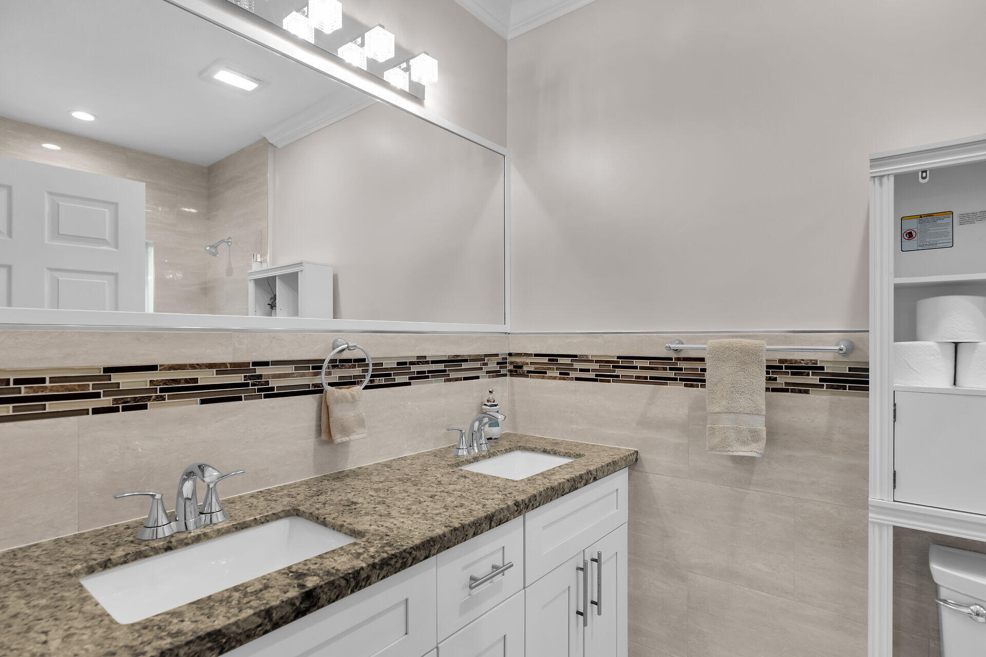 16 Jewfish Avenue Key Largo, FL 33037 - Photo 22 of 69 a bathroom with a granite countertop double vanity and a mirror