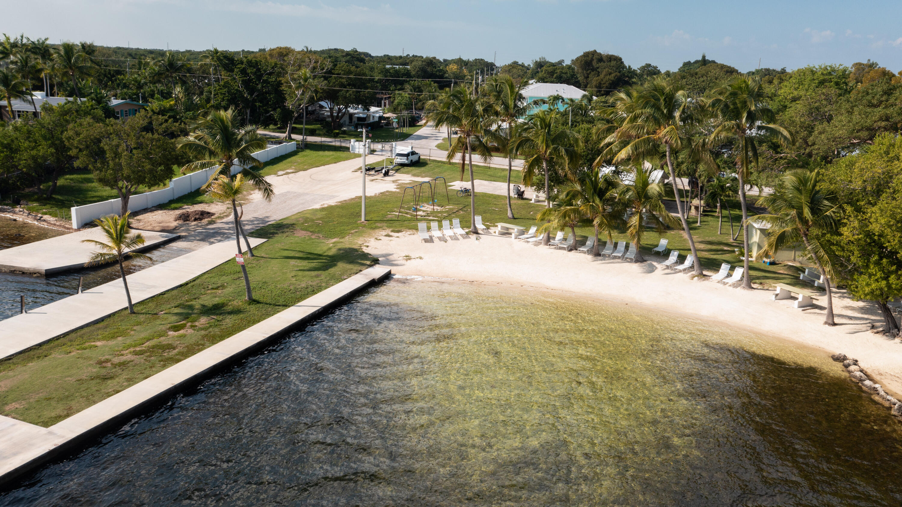 16 Jewfish Avenue Key Largo, FL 33037 - Photo 47 of 69 a view of a swimming pool with a yard