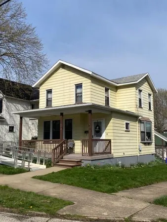 a front view of a house with porch