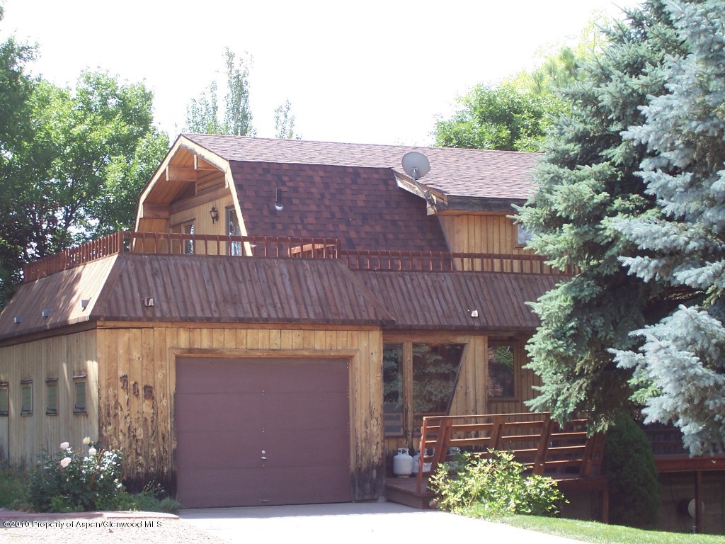 715 Buckeye Court Rifle, CO 81650 - Photo 16 of 16 a view of a house with a yard
