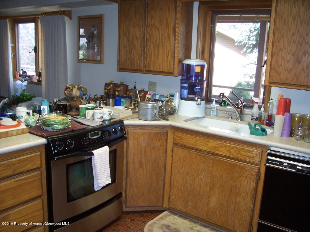 715 Buckeye Court Rifle, CO 81650 - Photo 2 of 16 a kitchen with a stove and a sink