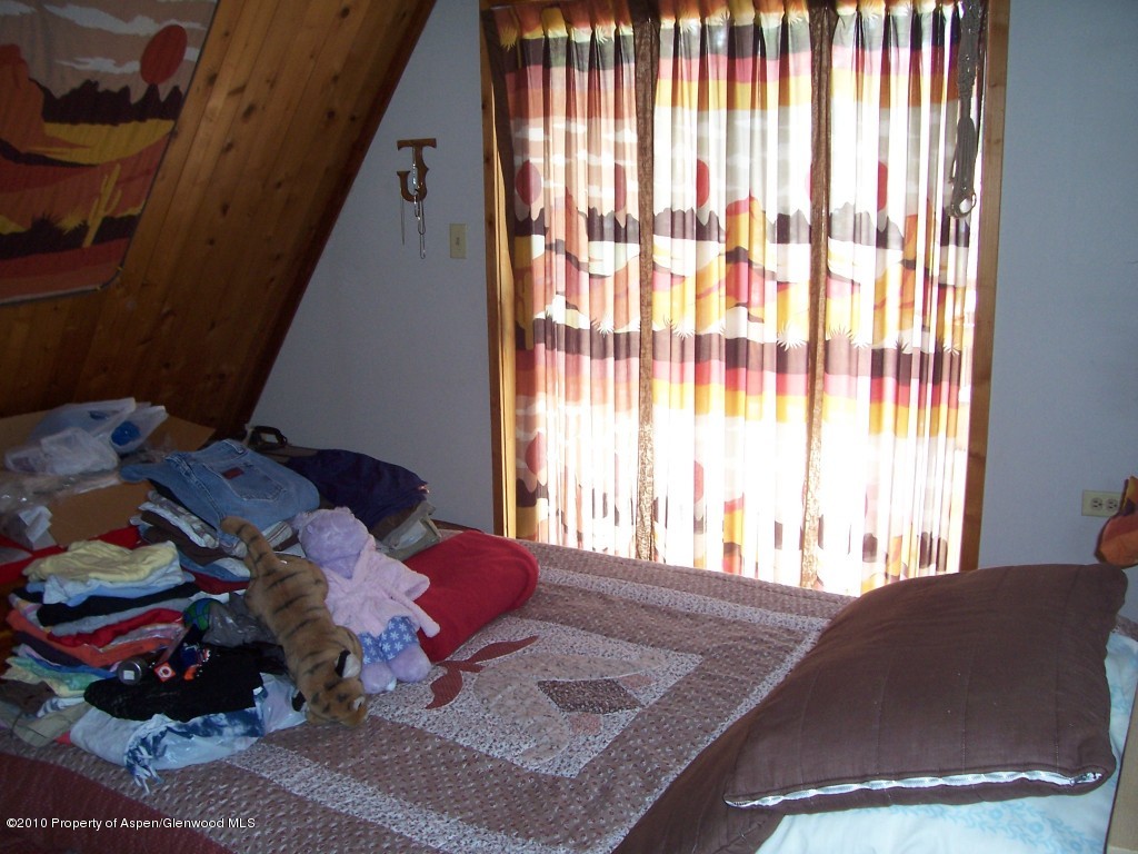 715 Buckeye Court Rifle, CO 81650 - Photo 8 of 16 a living room with furniture and a window