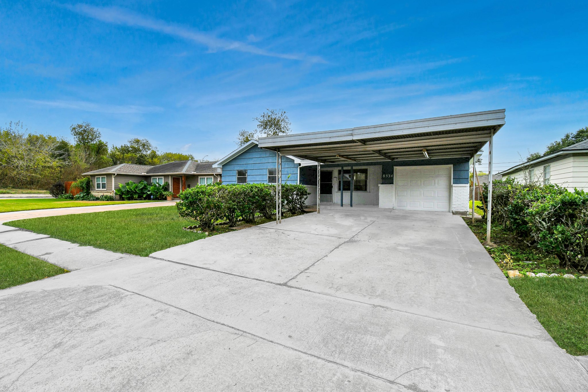 8534 Fillmore Street Houston, TX 77029 - Photo 2 of 39 Front exterior showcasing charming curb appeal, driveway, and convenient carport.