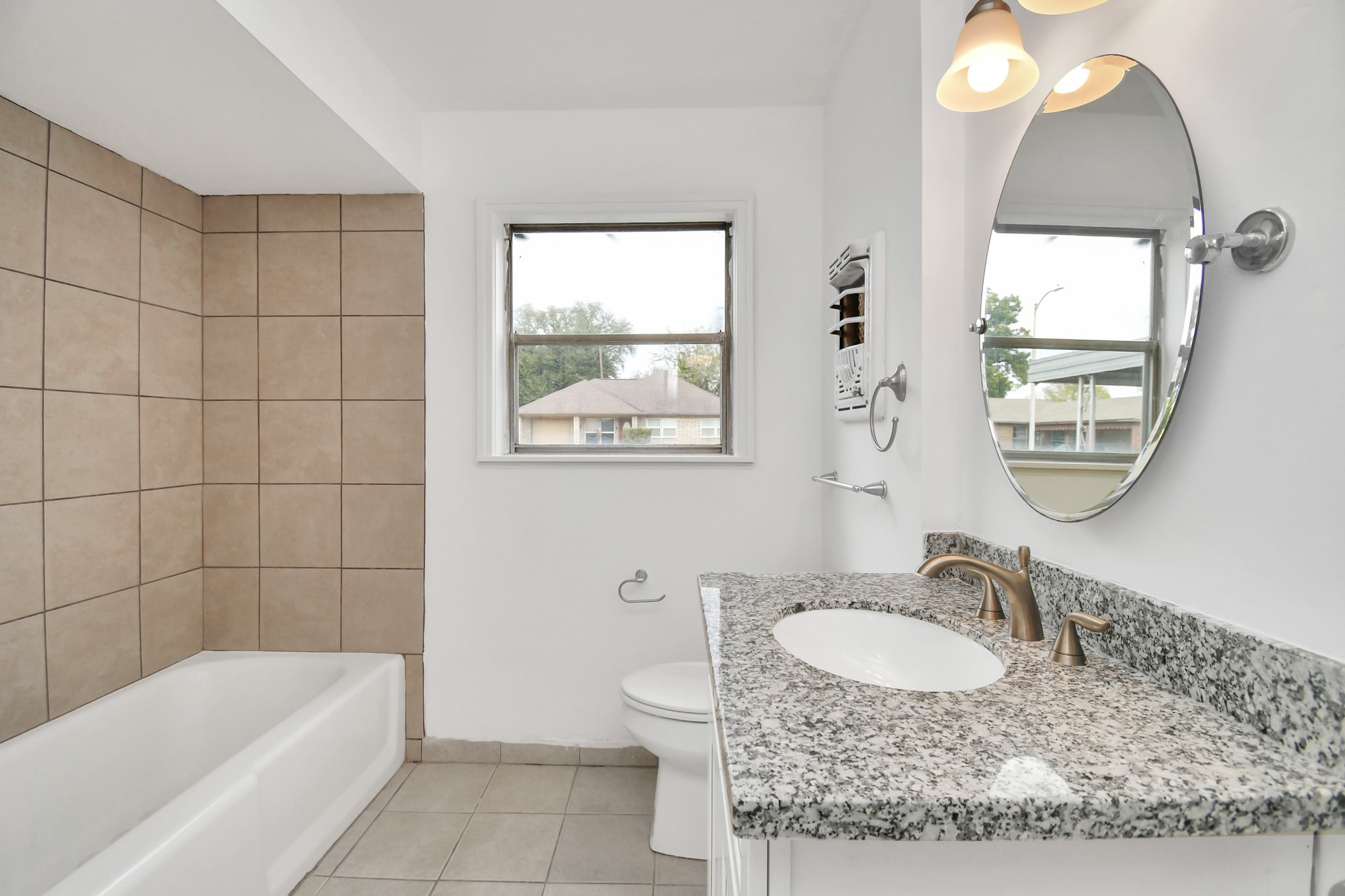 8534 Fillmore Street Houston, TX 77029 - Photo 24 of 39 The bathroom exudes a sense of spaciousness, cleanliness, and modernity.