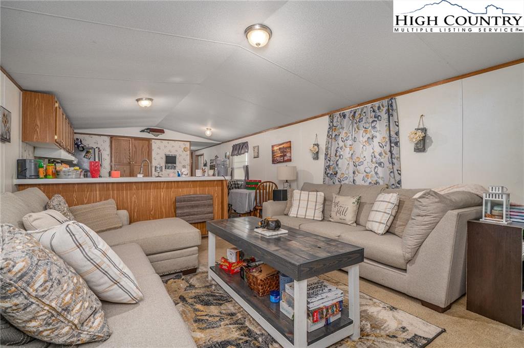 1310 Meat Camp Road Boone, NC 28607 - Photo 20 of 32 a living room with furniture and a table