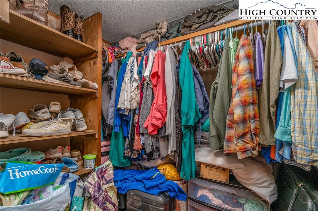 1310 Meat Camp Road Boone, NC 28607 - Photo 26 of 32 a view of walk in closet with clothes and shoes
