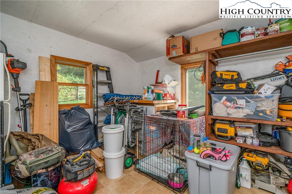 1310 Meat Camp Road Boone, NC 28607 - Photo 32 of 32 a room with toys and a wooden floor