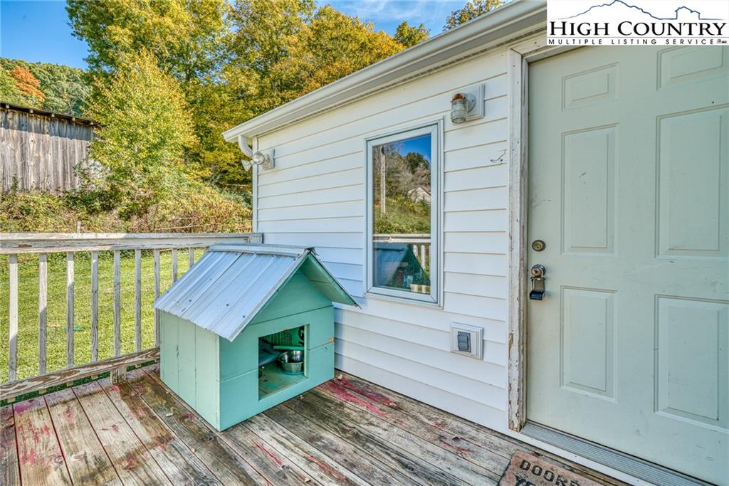 1310 Meat Camp Road Boone, NC 28607 - Photo 6 of 32 a view of a wooden house with a large window