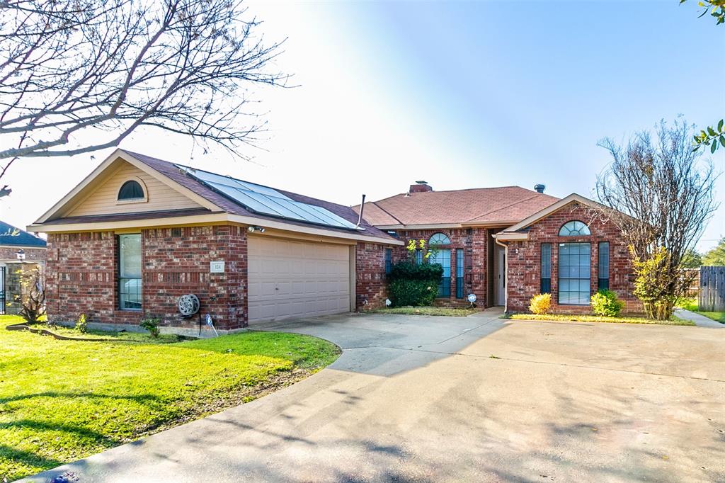 124 Villanova Circle Forney, TX 75126 - Photo 1 of 1 a front view of a house with a yard table and chairs