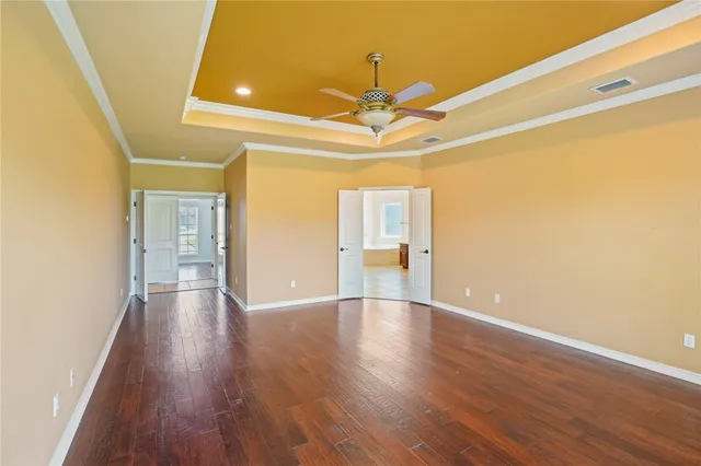 a large bathroom with a granite countertop double vanity sink a bathtub and window