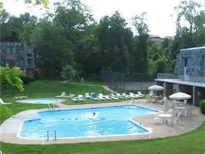 a view of a swimming pool with a patio