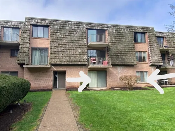 a front view of house with yard and outdoor seating