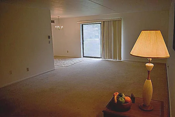 a lamp that is sitting in a room with a table