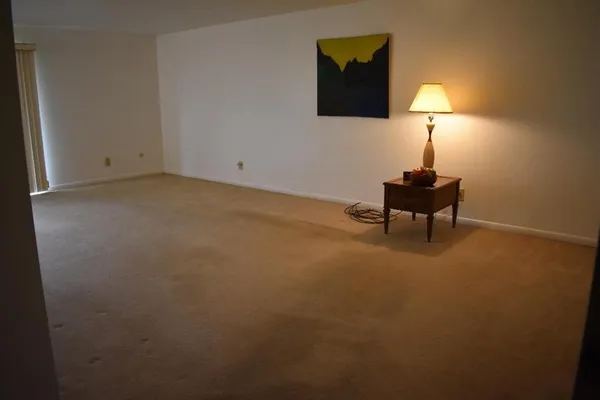a view of a small space with wooden floor