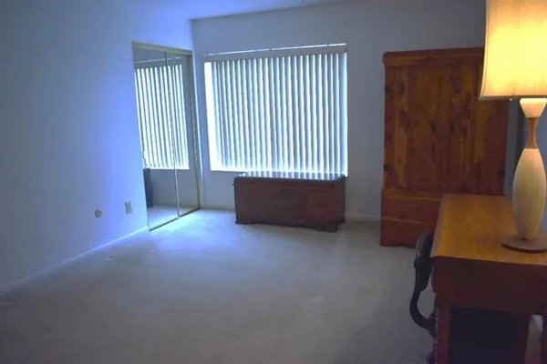 a view of room with window and lamp