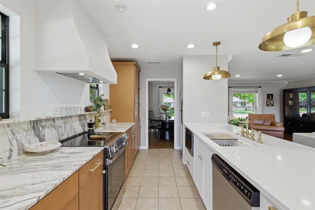 717 Ridgedale Drive Richardson, TX 75080 - Photo 12 of 40 Stunning kitchen with built in microwave.